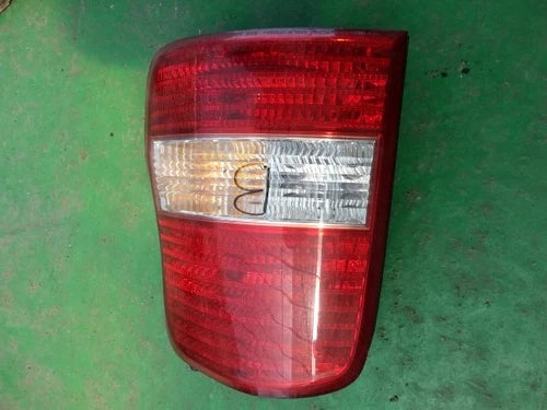 Used OEM Part - Combination Tail Light Assembly compatible with Kia Carnival 2001, genuine OEM replacement part 0K53A51150