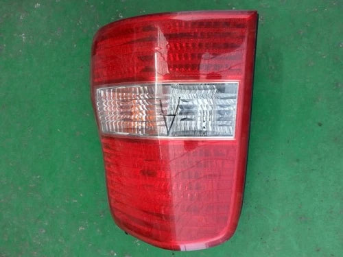 Right rear tail light assembly compatible with Kia Sedona 2000, genuine OEM replacement part 0K53A51150