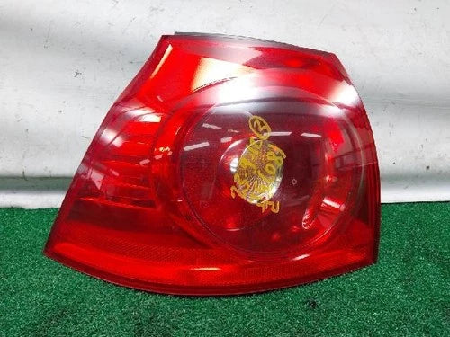 Left outer rear tail light assembly (driver side) for Volkswagen Golf 2008, genuine OEM replacement part 1K6945095N