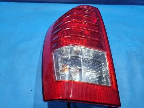 Left rear tail light assembly compatible with Kia Sedona 2010, genuine OEM replacement part 92401 4J000