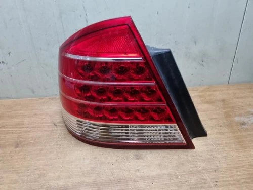 Left rear tail light assembly compatible with Ford Five Hundred 2006, genuine OEM replacement part 5T5313B505