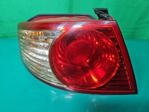 Left rear combination tail light assembly compatible with Kia Amanti 2006, genuine OEM replacement part 92401 3F270