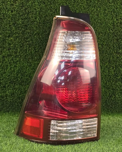 Left rear tail light (driver side) compatible with Toyota 4Runner 2003-2009. Genuine part used