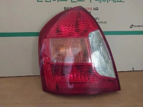 Left rear combination tail light assembly compatible with Hyundai Accent 2007, genuine OEM replacement part 92401 1E000