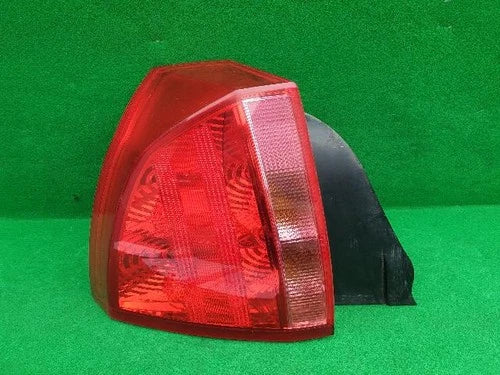 Left rear tail light assembly compatible with Cadillac BLS 2006, genuine OEM replacement part 12759587