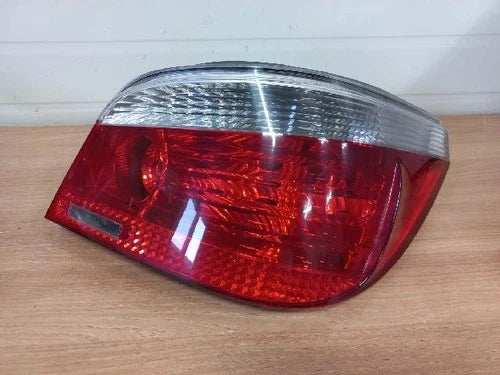 Left rear tail light assembly (driver side) for BMW 525i sedan 2005, genuine OEM replacement part 6923305