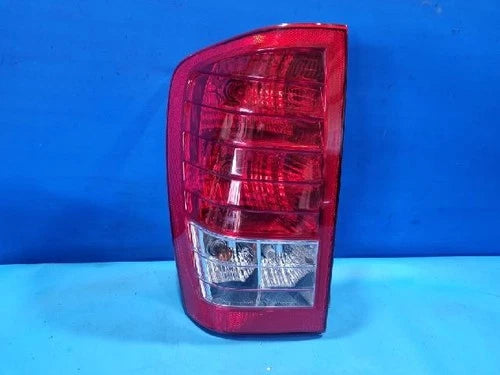 Left rear tail light assembly compatible with Kia Carnival 2011, genuine OEM replacement part 92401 4J000